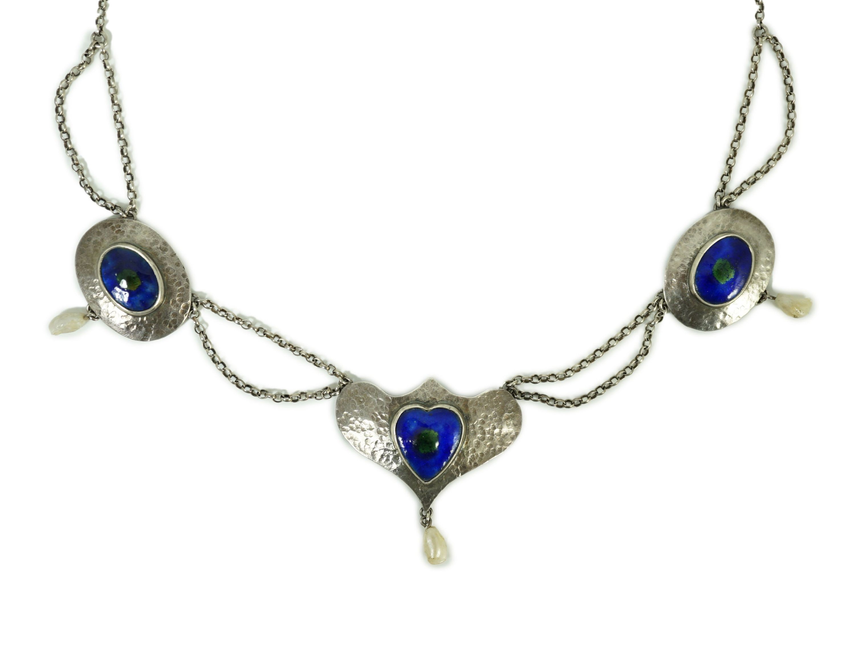 A stylish early 20th century sterling, enamel and baroque drop pearl set necklace